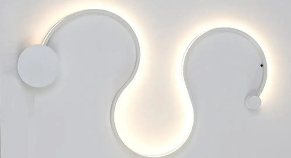 Modern black serpentine led wall lamp with sleek white curved sconce and soft ambient lighting for living room use