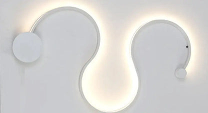 Modern black serpentine led wall lamp with sleek white curved sconce and soft ambient lighting for living room use