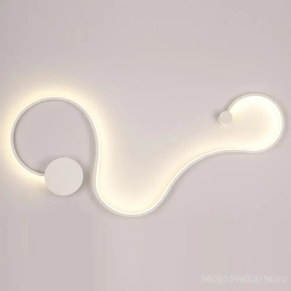 Modern black serpentine led wall lamp with sleek abstract white led wall sconce featuring smooth curves and circular accents