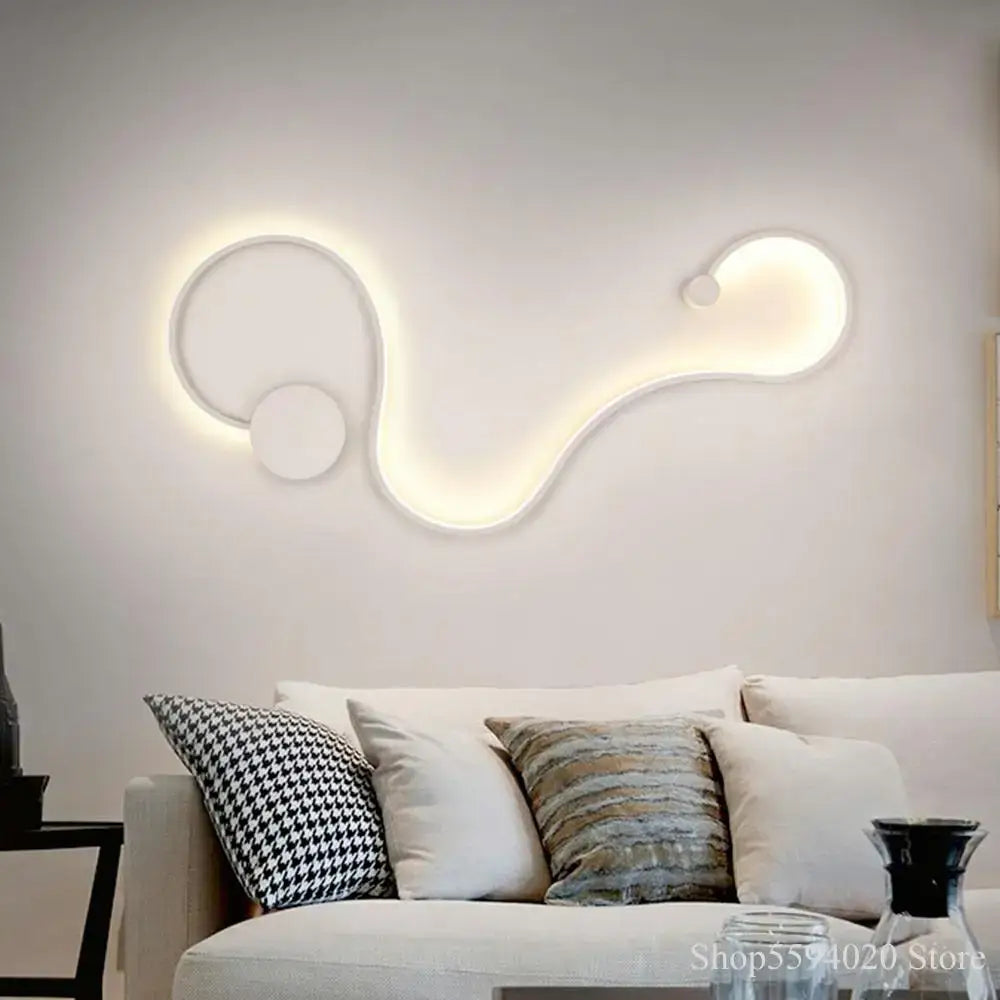 Modern black serpentine led wall lamp with sleek white led wall sconce featuring abstract curved design for living room use