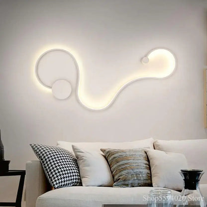 Modern black serpentine led wall lamp with sleek white led wall sconce featuring abstract curved design for living room use