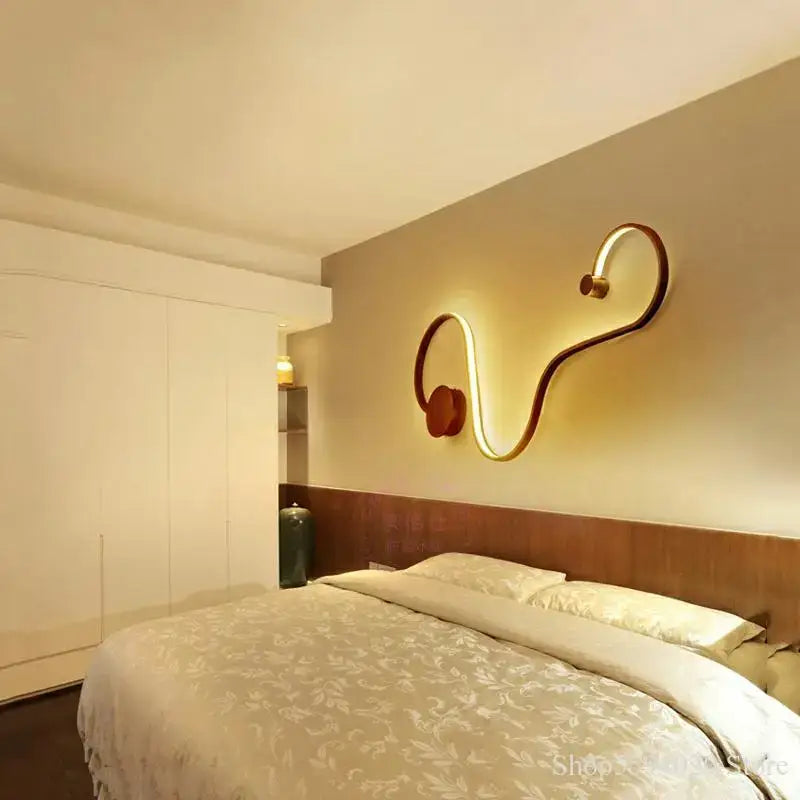Modern black serpentine led wall sconce with sleek metallic frame and warm glow for living room decorbites led wall sconce