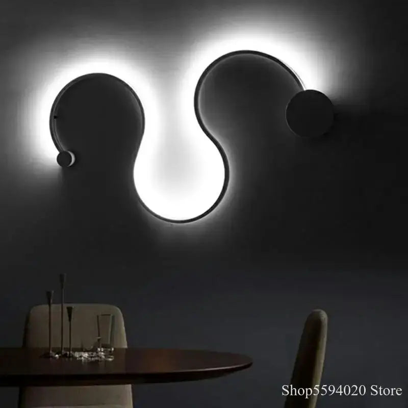 Modern black serpentine led wall sconce with glowing white light ring for living room decor and decorbites led wall use