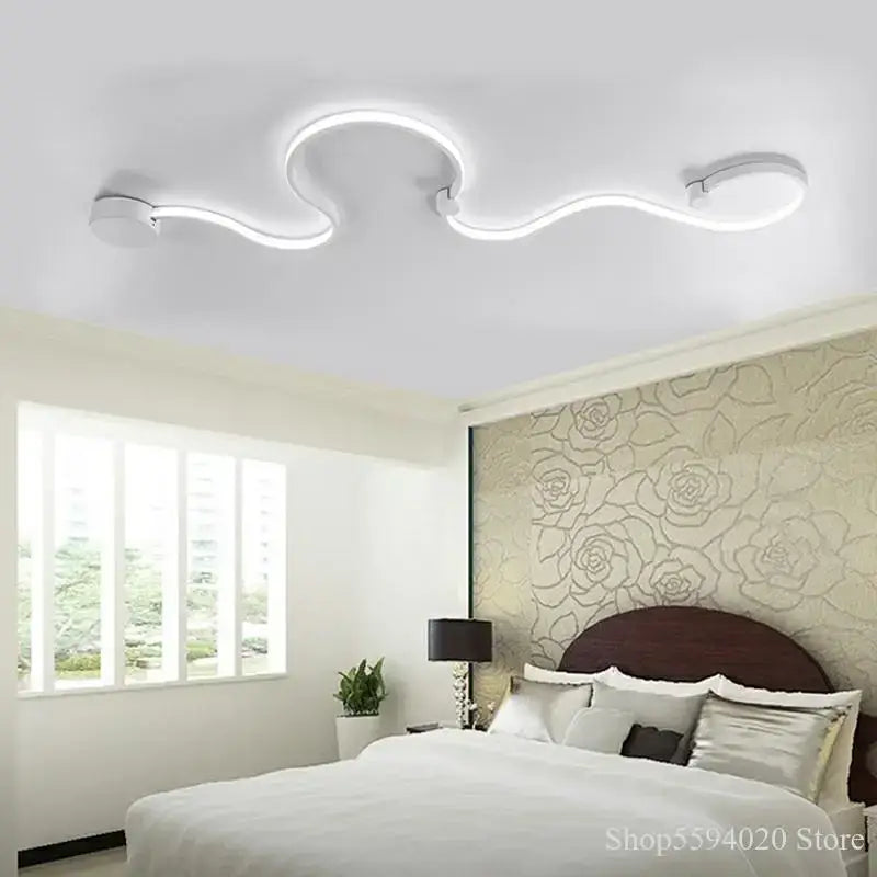 Modern white led ceiling light with sleek curved design complementing black serpentine led wall sconce decorbites wall sconce