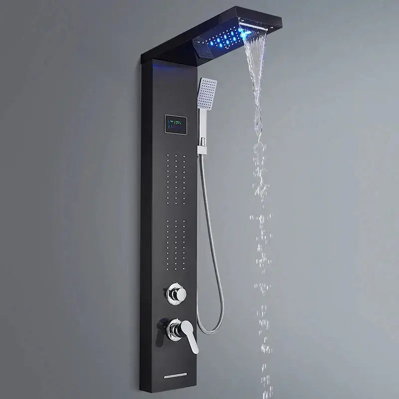 Modern black shower panel rainfall waterfall system with large rainhead emitting blue led light and handheld showerhead