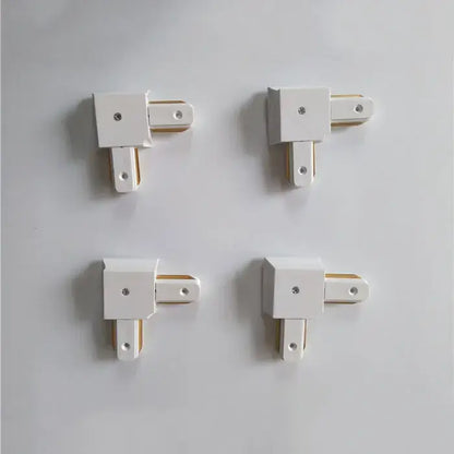 White plastic decorbites ceiling track connector set with gold metal inserts for modern black and silver ceiling track rail