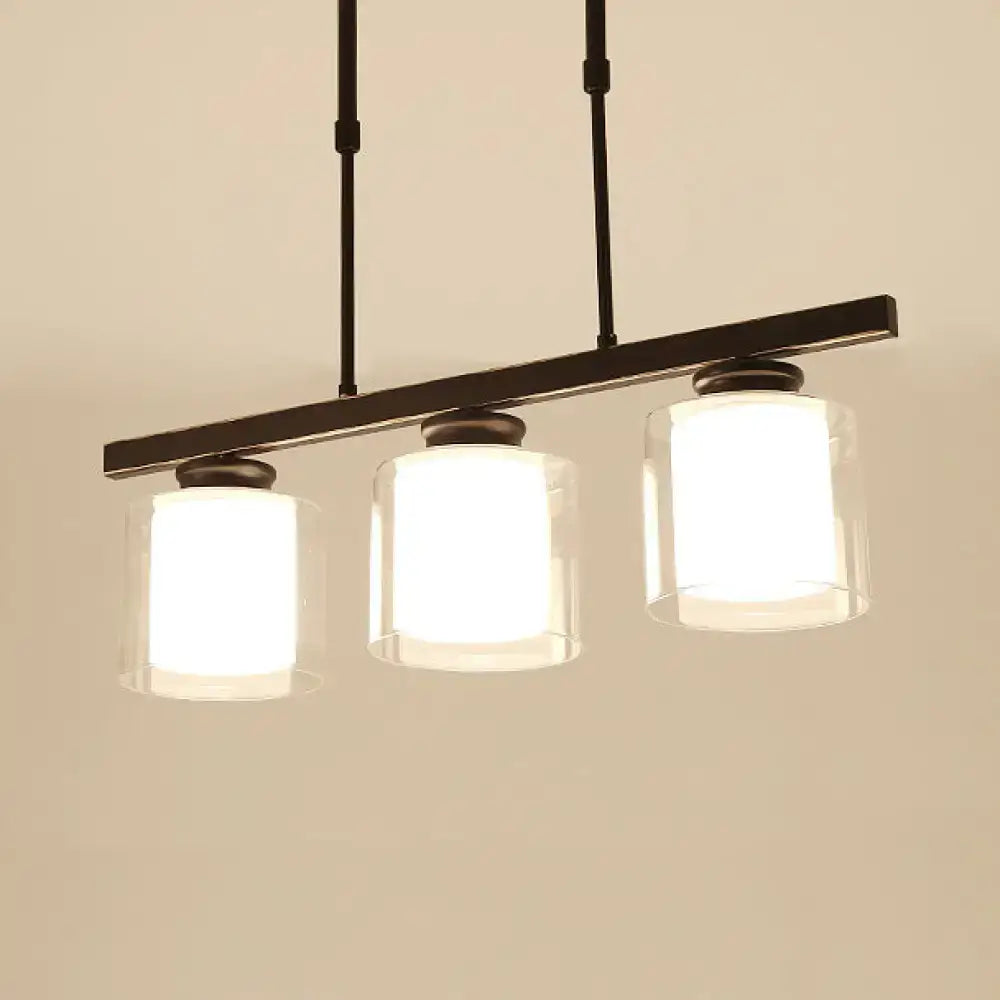 Modern black metal pendant light with three clear glass cylindrical shades ideal for cooking space with e26 e27 bulbs
