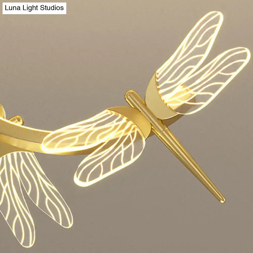 Golden dragonfly-shaped led ceiling light with glowing edges and intricate wings by decorbites for restaurant ceilings