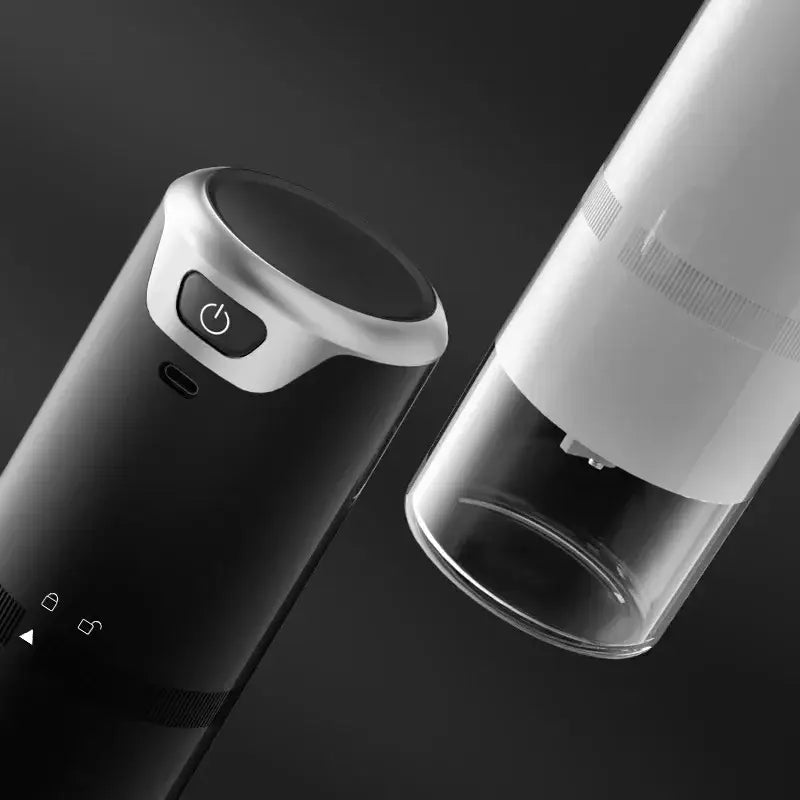 Modern black and silver espresso coffee tamper with usb-c port and lock icons on handle for barista grinder use