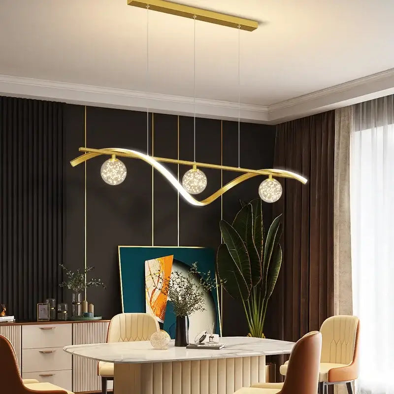 Modern black and silver glass ball led pendant light with gold-toned metal arm and three spherical glass globe bulbs for dining room decorbites pendant light