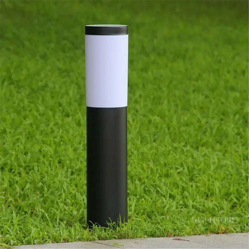 Modern black and silver landscape path light featuring a sleek black and white cylindrical outdoor bollard design decorbites black silver