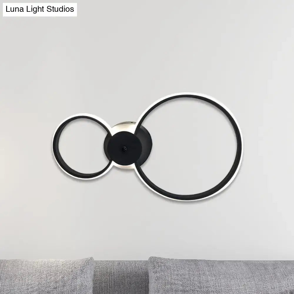 Modern black and silver LED hoop wall lamp with two interlocking rings for bedroom ceiling lighting