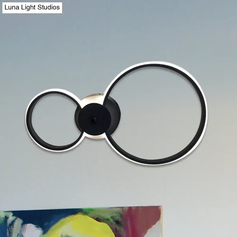 Modern black and silver led hoop wall lamp with sleek minimalist circular ceiling light design for bedroom use