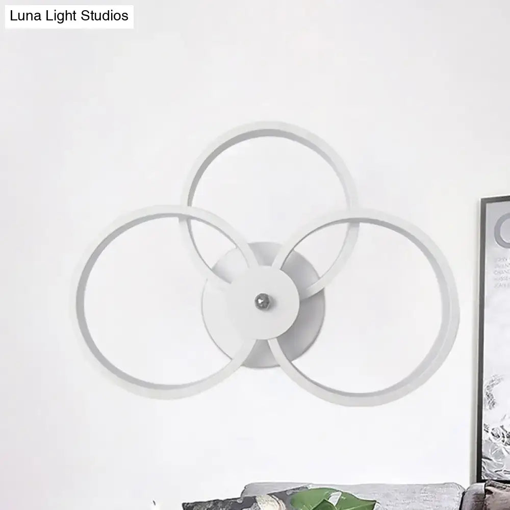 Modern white circular wall lamp with three interlocking rings for bedroom ceiling lighting with LED hoops