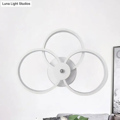 Modern white circular wall lamp with three interlocking rings for bedroom ceiling lighting with LED hoops