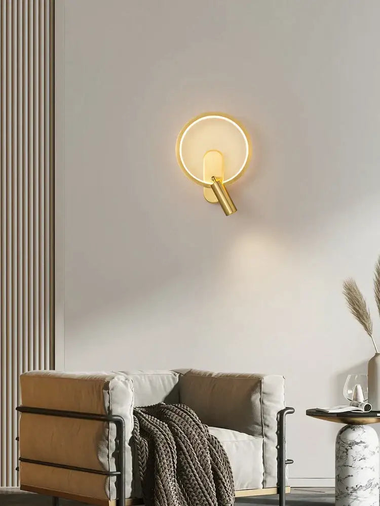 Modern black and silver led wall lamp featuring a gold-toned brass copper led circular sconce with warm ambient lighting