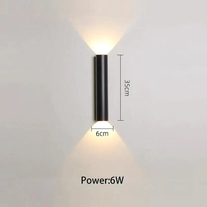 Modern black and silver led wall lamp featuring dual downward-facing light sources in a cylindrical design