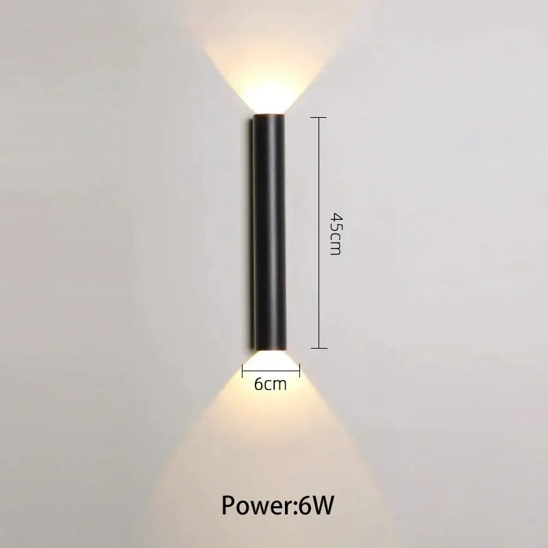 Modern black and silver led wall lamp with two downward-facing light sources for bedroom use