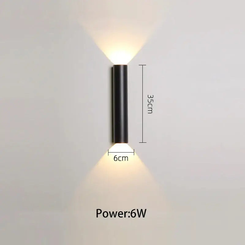 Modern black and silver led wall lamp with lone line design and two warm white downward beams for bedroom or tv background
