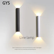 Modern black and silver led wall lamp with sleek cylindrical design emitting warm focused light for bedroom or tv background