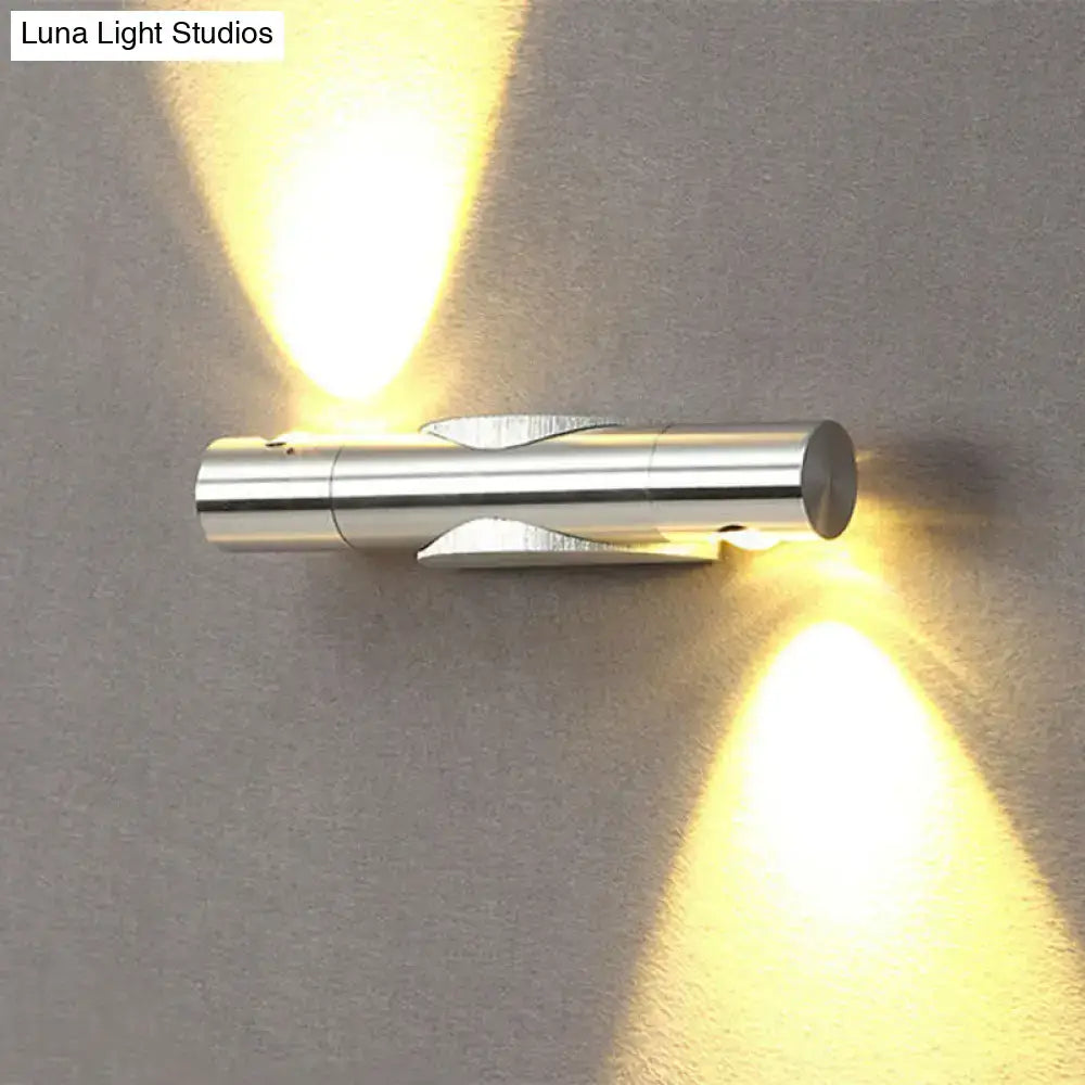 Modern silver metallic wall sconce light fixture with dual warm white lighting for living room use
