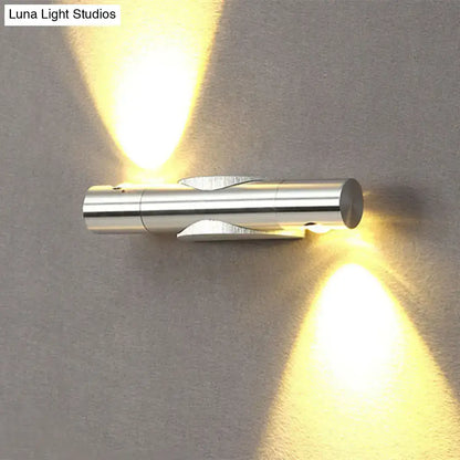 Modern silver metallic wall sconce light fixture with dual warm white lighting for living room use