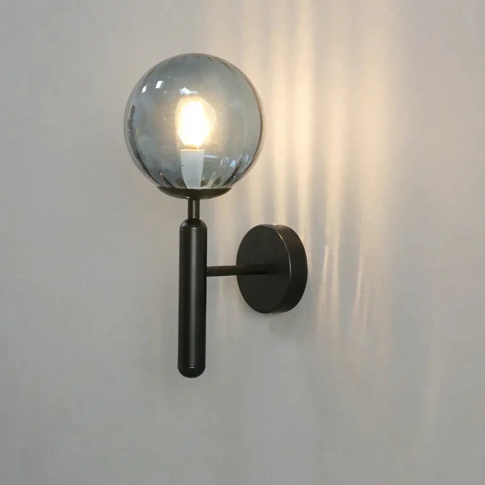 Modern black metal wall lamp with frosted decorbites glass ball led shade ideal for bedroom sconce lighting