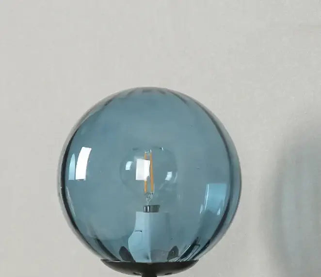 Modern black smoked glass ball led wall lamp with a sleek spherical blue glass ball led filament bulb for bedroom decorbites wall lamp