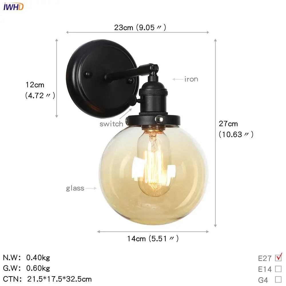 Modern black iron wall sconce with frosted amber decorbites glass ball and exposed filament bulb for hallway lighting