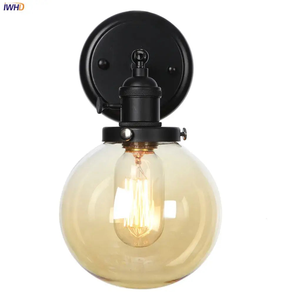 Modern black metal wall sconce with smoked glass ball and exposed filament bulb for decorbites glass ball wall lighting