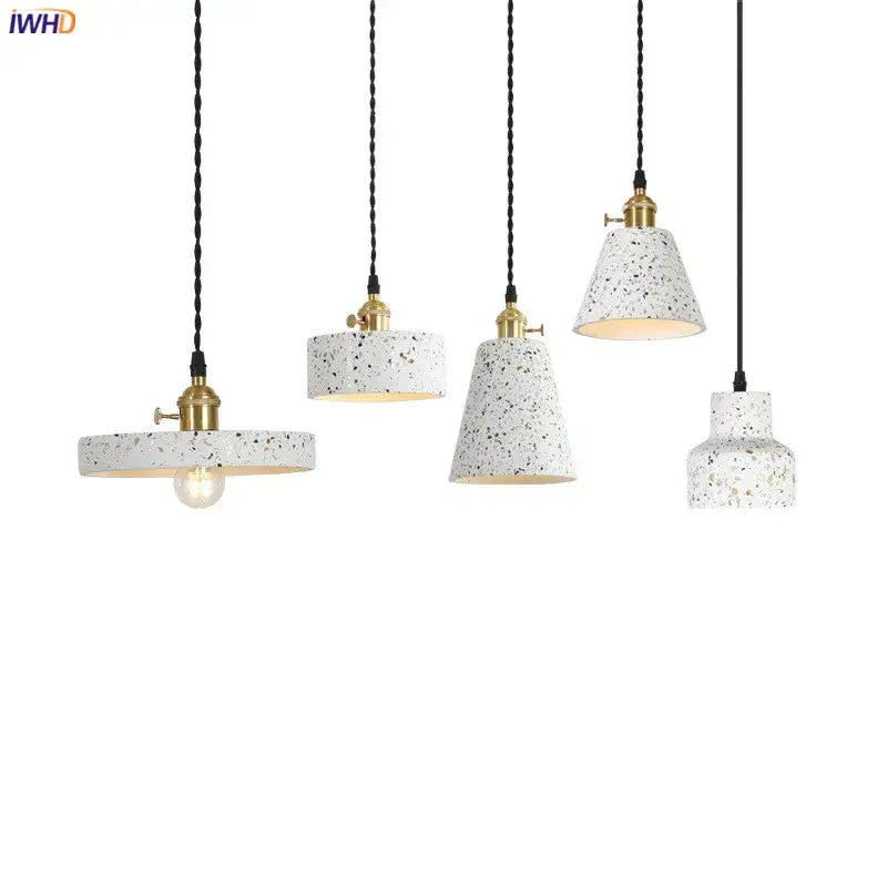 Set of five white terrazzo decorbites cement pendant lamps with gold-toned fixtures and black twisted cords for modern kitchen decor