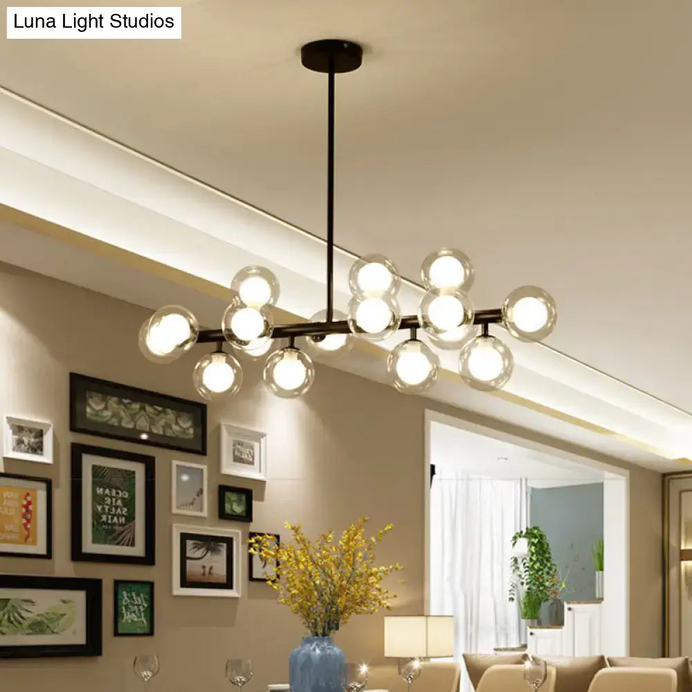 Modern black metal ceiling light with spherical glass globe bulbs and distinctive bulb base for dining room chandelier
