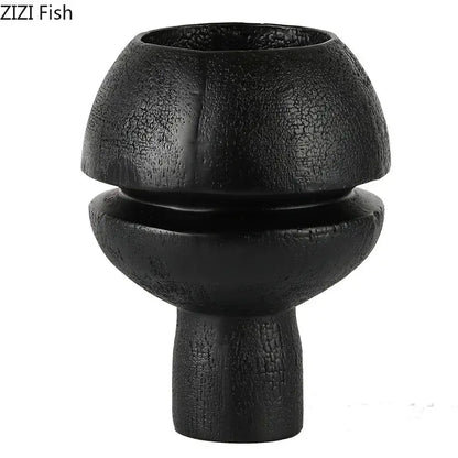 Modern black spherical resin sculpture with a textured cracked finish in two stacked rounded tiers for living room decorbites black spherical decor