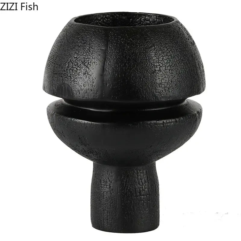 Modern black spherical resin sculpture with a textured cracked finish in two stacked rounded tiers for living room decorbites black spherical decor