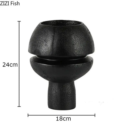 Black spherical resin sculpture decorbites modern black textured ceramic vase with bulbous upper section and slender stem
