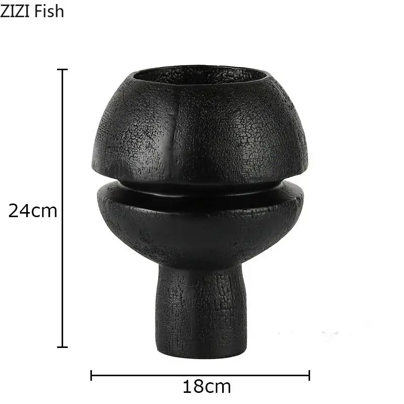 Black spherical resin sculpture decorbites modern black textured ceramic vase with bulbous upper section and slender stem
