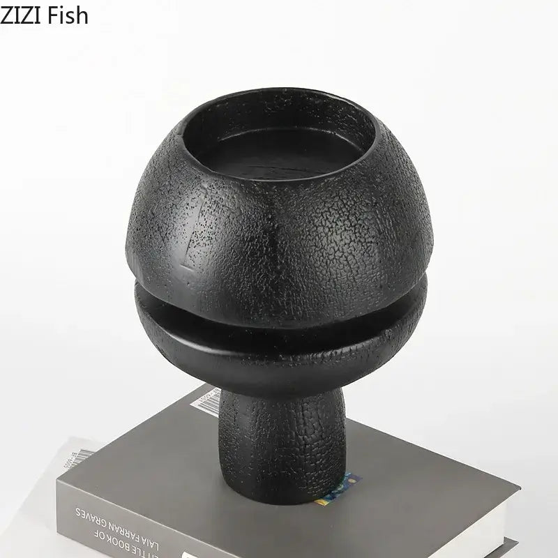 Modern black spherical resin sculpture with cracked textured ceramic candle holder design for living room decorbites black spherical