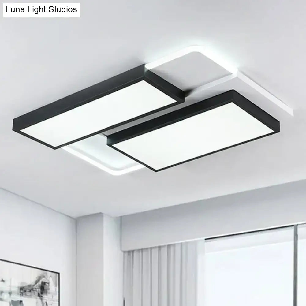 Modern black DecorBites™ LED flush ceiling light fixture with acrylic overlapping panels emitting bright white light