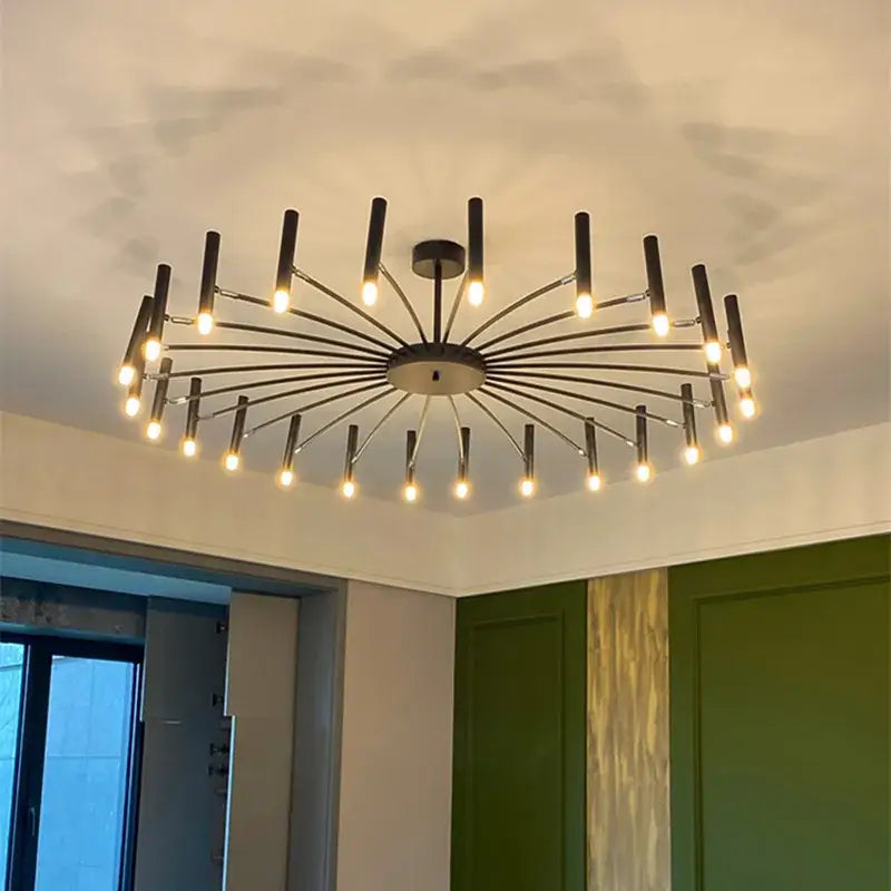 Modern black sputnik chandelier with multiple slender arms and cylindrical metal light fixtures by decorbites black