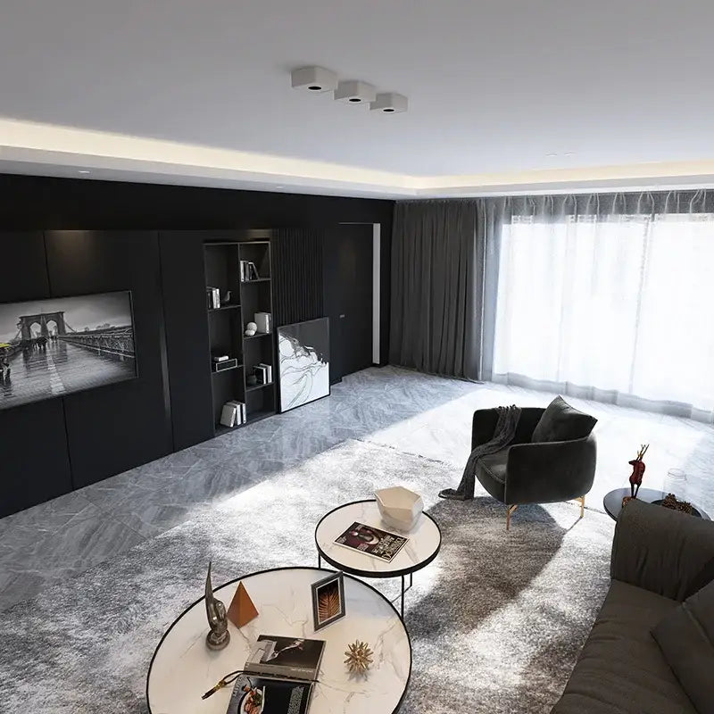 Modern black armchair with gold-tone legs and gray throw paired with decorbites led surface mount ceiling light