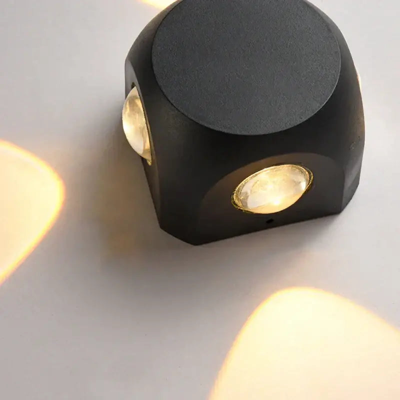 Modern black square led wall light with two warm glowing bulbs for outdoor garden sconce decor