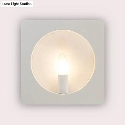 Modern black square wall sconce lamp with minimalist white circular frosted glass diffuser and exposed led bulb