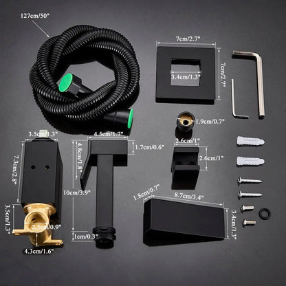 Black matte-finish modern bathroom faucet kit with brass accents and a coiled black hose featuring green-tipped connectors.