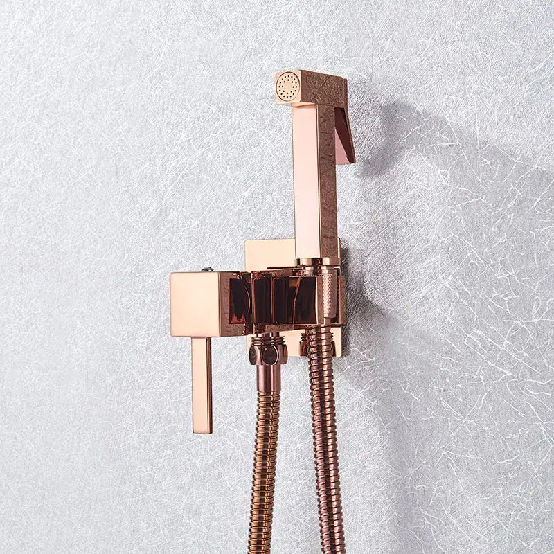 Rose gold decorbites brass bidet faucet with sleek modern design and textured finish for bathroom use