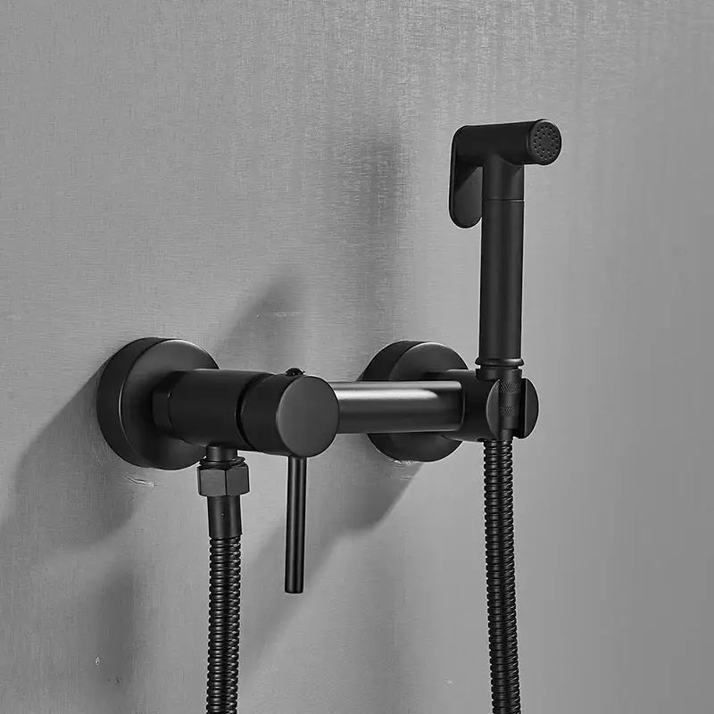 Modern black matte-finished brass bidet faucet with sleek wall-mounted spray and flexible hose for bathroom use
