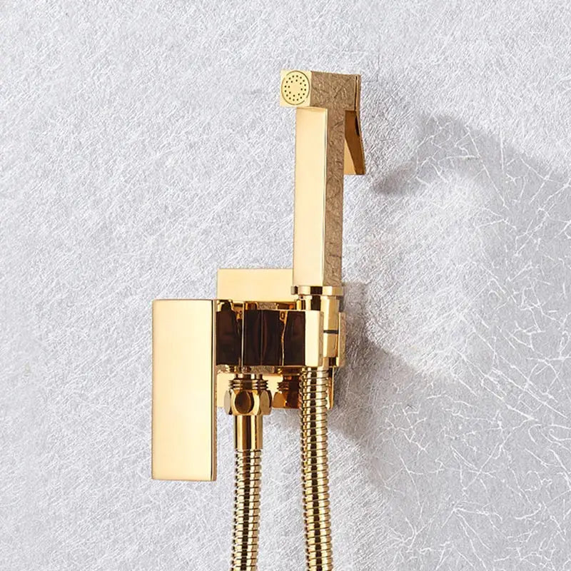 Modern black and stainless steel brass bidet faucet with gold-finished rectangular shower faucet and textured accents