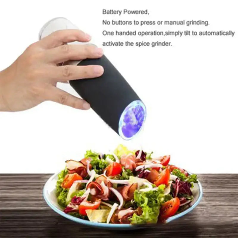Modern black and stainless steel electric salt pepper grinder with glowing blue circular opening and battery-powered design