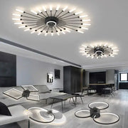 Modern black starburst chandelier ceiling fan with multiple glowing white led bulbs for living room lighting