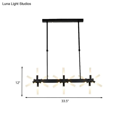 Black metal chandelier with three starburst-style warm lights featuring linear acrylic shade ideal over dining island