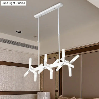 Modern white geometric chandelier with angular branch-like arms and linear acrylic shade for dining room by DecorBites
